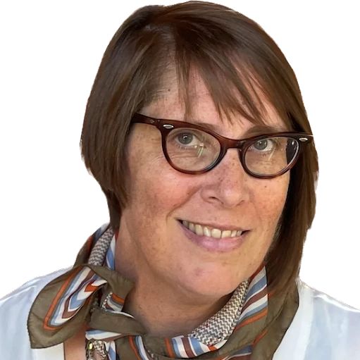 Brenda Vitale's headshot: Women with short brown hair and glasses wearing a scarf.